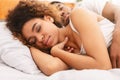 Loving couple sleeping in bed and hugging Royalty Free Stock Photo