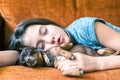 Sweet dream. Young girl sleeping hugging her lovely dog