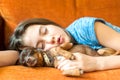 Sweet dream. Young girl sleeping hugging her lovely dog