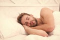 Sweet dreams. Health care concept. Circadian rhythm regulates sleep wake cycle. Man handsome unshaven guy in bed. Enough Royalty Free Stock Photo