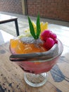 Sweet drinks full of fruit and jelly are served very beautifully and deliciously in semi-circular glasses