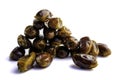 Sweet dry dates folded down and laid out on a white background