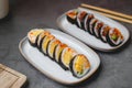 Sweet egg sushi roll or tamago roll. Japanese traditional food made from rice and seaweed Royalty Free Stock Photo