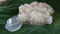 Sweet fermented rice wrapped by Elephant's ear plant leave , dessert in Thai kitchen