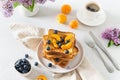 Sweet french toast with berries and syrup served on plate. Copy space for text. Healthy breakfast: toasts with blueberry and Royalty Free Stock Photo