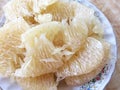 Sweet fresh pomelo peeled in a plate