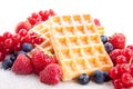 Sweet fresh tasty waffles with mixed fruits