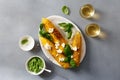 Sweet fried corn with basil sauce, feta cheese, wine top view Royalty Free Stock Photo