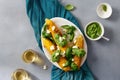 Sweet fried corn with basil sauce, feta cheese, wine top view Royalty Free Stock Photo