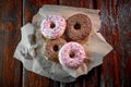 Sweet fried donuts on wooden table, top view