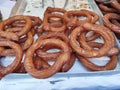 Sweet fried pastries round Spanish churros on the shop window Royalty Free Stock Photo