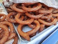 Sweet fried pastries round Spanish churros on the shop window Royalty Free Stock Photo