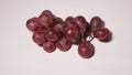 Sweet Frozen red grapes cluster on white background. Royalty Free Stock Photo