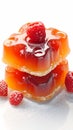 Sweet fruit dessert jelly adorned with strawberries on white background