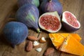 Whole and cut figs with almonds and cheese