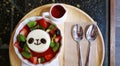 Sweet fruity syrup and the panda face pudding. Royalty Free Stock Photo