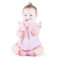 Sweet funny baby girl in a pink dress Royalty Free Stock Photo