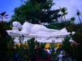 Sweet Garden With White Buddha Sleeping At Buddhist Temple