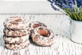 Sweet gingerbread cookies in white glaze, in an aluminum mug a bouquet of lavender flowers
