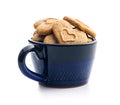 Sweet gingerbread hearts in cup isolated on white background Royalty Free Stock Photo
