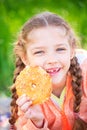 Sweet girl with a fallen tooth holding cookies in her hand Royalty Free Stock Photo