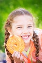 Sweet girl with a fallen tooth holding cookies in her hand Royalty Free Stock Photo