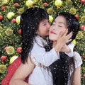 Sweet girl kiss her mother in xmas day Royalty Free Stock Photo