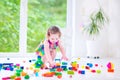 Sweet girl playing with blocks Royalty Free Stock Photo