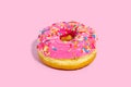 Sweet glazed pink doughnut isolated on colorful background