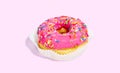 Sweet glazed pink doughnut isolated on colorful background