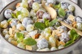 Sweet grape salad with almonds and mint with yogurt dressing close-up in a plate. Horizontal Royalty Free Stock Photo