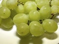 Sweet green grapes on white plate Royalty Free Stock Photo