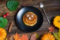 Sweet Halloween food, pumpkin pancakes for kids Royalty Free Stock Photo