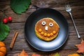 Sweet Halloween food, pumpkin pancakes for kids Royalty Free Stock Photo