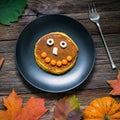 Sweet Halloween food, pumpkin pancakes for kids Royalty Free Stock Photo