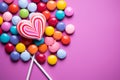 Sweet harmony rainbow heart candies arranged on a pink background