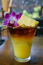 Sweet Hawaiian Mai Tai cocktail with an orchid flower Royalty Free Stock Photo