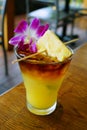 Sweet Hawaiian Mai Tai cocktail with an orchid flower Royalty Free Stock Photo