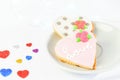 Sweet heart cakes for Sant Valentines day on the white plate on the white background. Romantic sweets for holiday Royalty Free Stock Photo