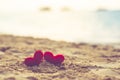 Sweet heart on sand beach under sunset and warm light. abstract background love summer on the beach. vintage color Royalty Free Stock Photo