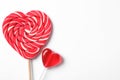 Sweet heart shaped lollipops on white background, flat lay with space for text. Valentine`s day celebration Royalty Free Stock Photo