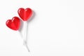 Sweet heart shaped lollipops on white background, flat lay with space for text. Valentine`s day celebration Royalty Free Stock Photo