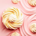 Sweet cupcakes with whipped cream on rose background