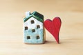 Sweet home concept, mini house symbol and red heart Royalty Free Stock Photo