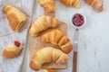 Sweet home made croissant with jam on a table Royalty Free Stock Photo