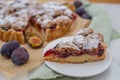 Sweet home made plum crumble pie on a table Royalty Free Stock Photo