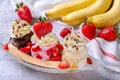 Sweet homemade banana split sundae with chocolate vanilla and strawberry ice cream on glass bowl, decoration topping fresh Royalty Free Stock Photo