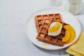 Sweet Homemade Belgian Waffle with honey, peaches in syrup, whipped cream in plate on grey surface, copy space. Healthy breakfast Royalty Free Stock Photo