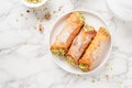 Sweet homemade cannoli stuffed with ricotta cheese and pistachio. Sicilian dessert. Italian pastry. Royalty Free Stock Photo