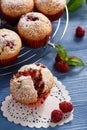 Sweet homemade raspberry muffins on wooden table. Royalty Free Stock Photo